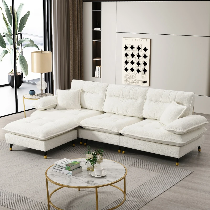 Modern white sectional sofa with cushions in stylish living room setup