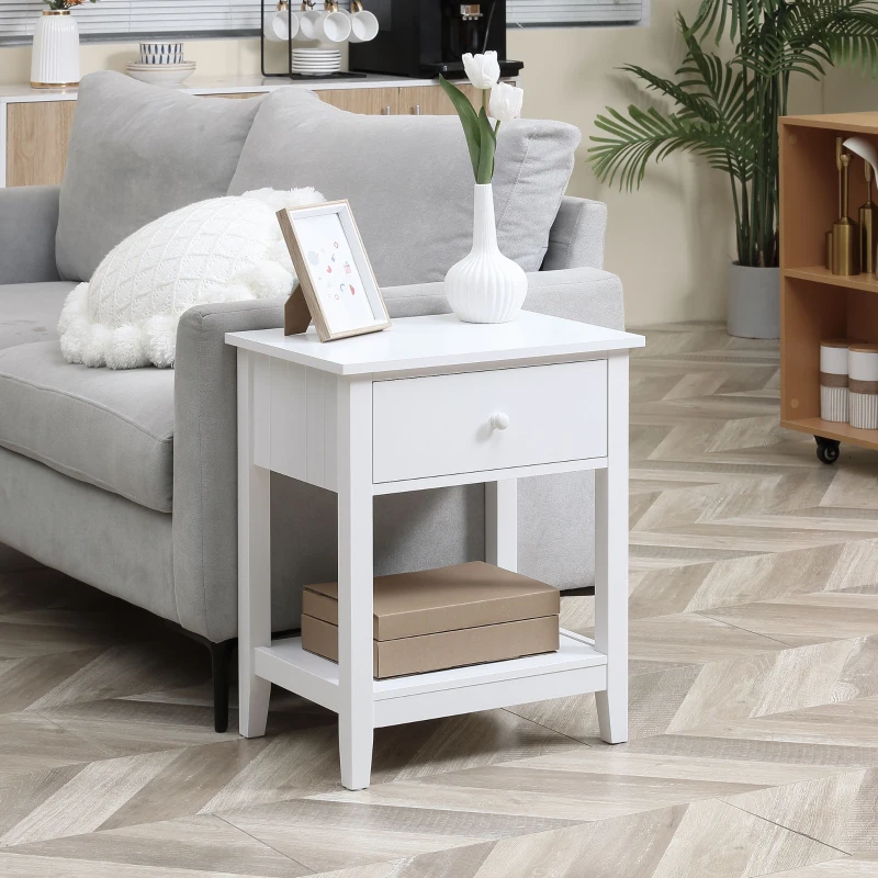 White wooden end table with drawer and bottom shelf beside sofa
