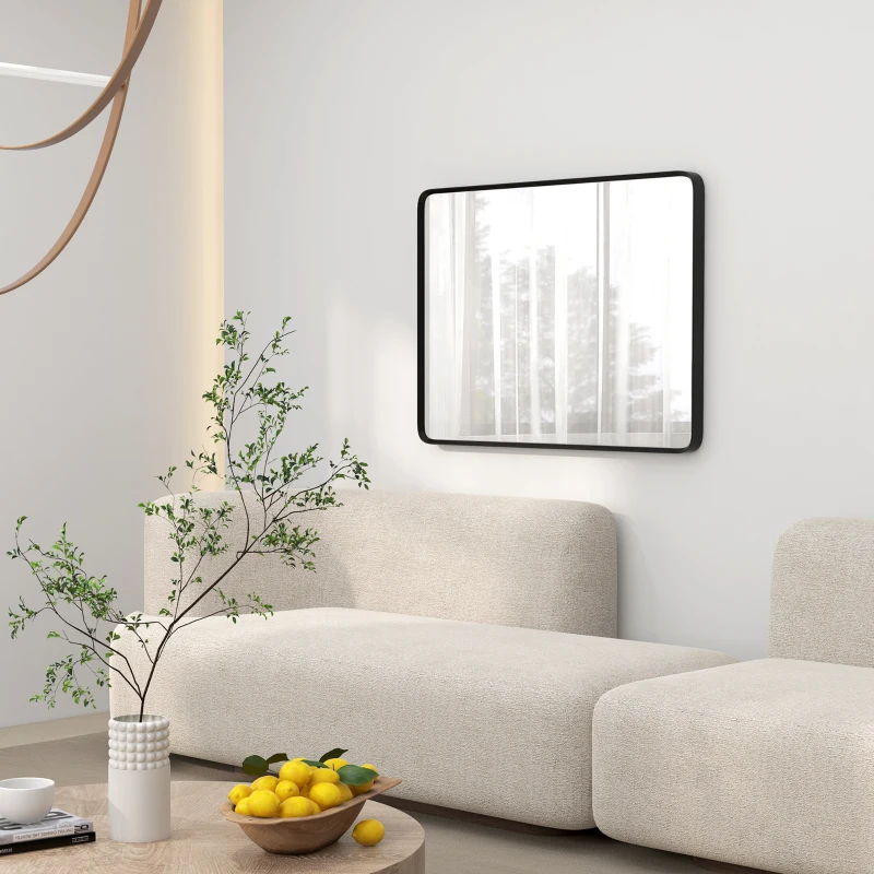 Minimalist living room with black-frame square wall mirror.