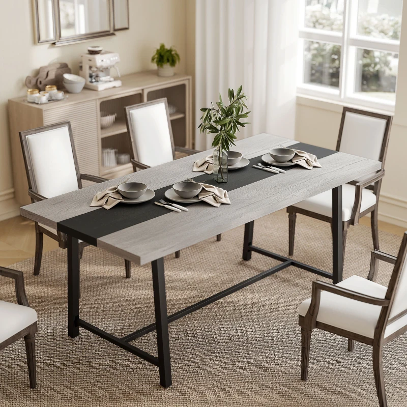 Spacious dining room with gray industrial table and elegant white chairs
