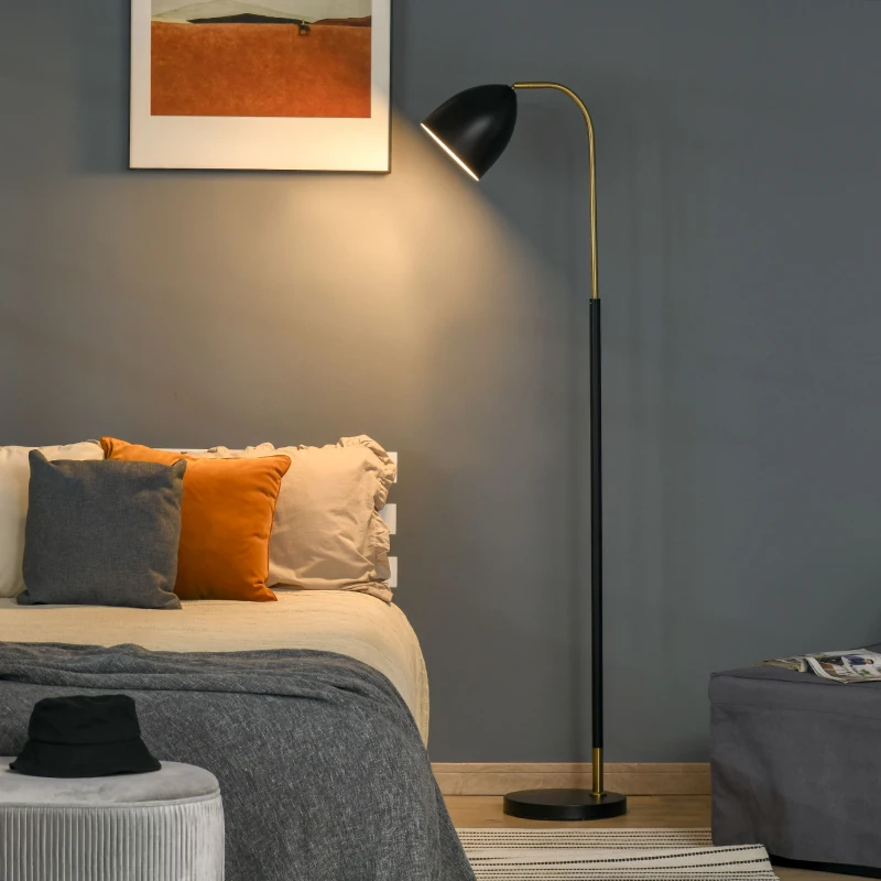 Arc floor lamp with black shade lighting bedroom corner