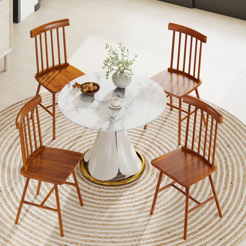 Round marble dining table with four wooden Nordic chairs