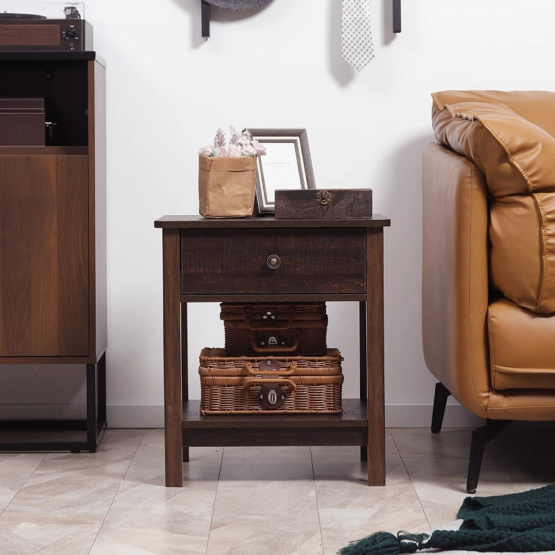 Rustic dark brown end table with storage baskets beside leather couch
