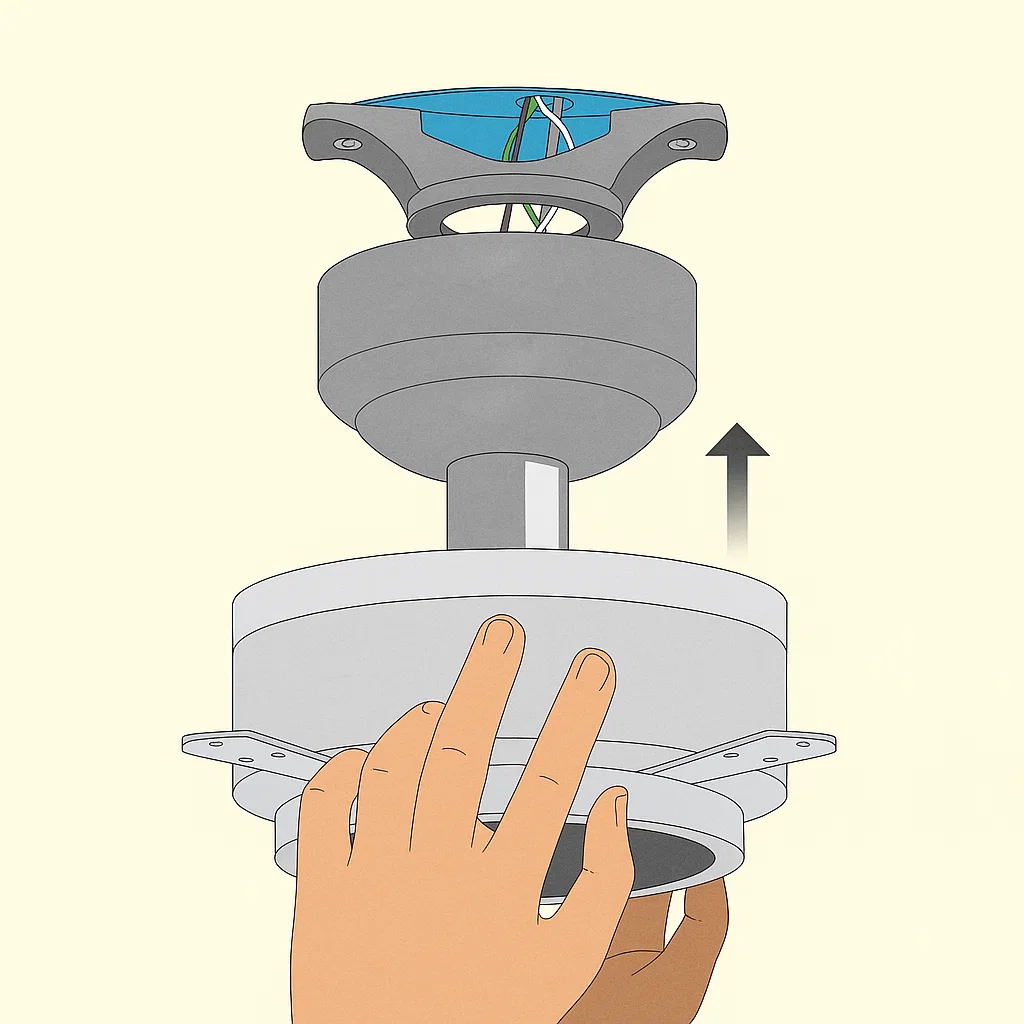 Person lifting ceiling fan motor to hang on ceiling mounting bracket