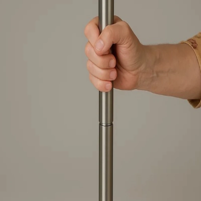 Person holding vertical lamp pole to secure connection tightly