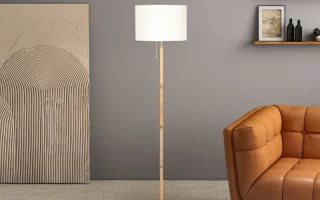 Modern floor lamp beside brown sofa in stylish living room
