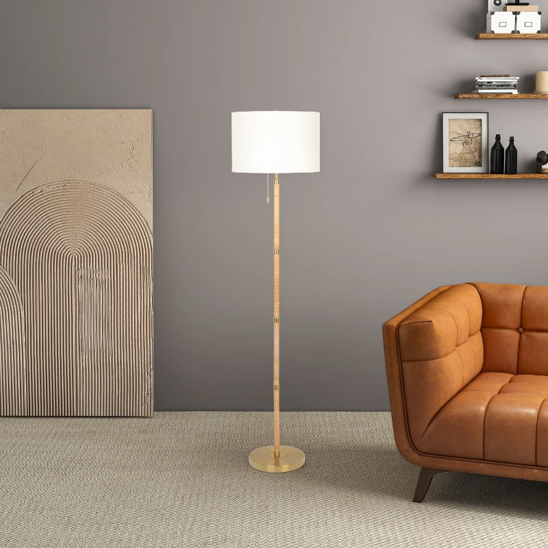 Modern floor lamp beside brown sofa in stylish living room
