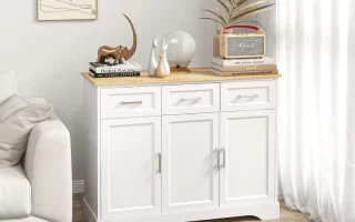 White modern sideboard with decorative art and books in bright living room.