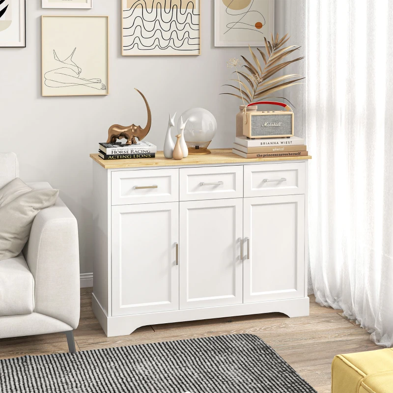 White modern sideboard with decorative art and books in bright living room.