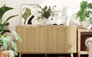 Light oak sideboard with plants and art in cozy home interior