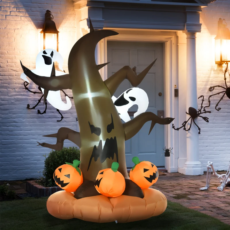 Inflatable Halloween tree with glowing pumpkins and ghosts outdoors.