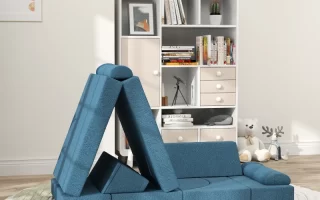 Blue foldable foam play couch arranged in cozy kids’ room.
