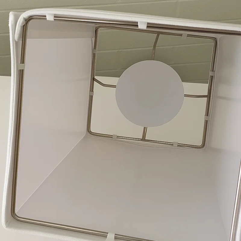 White lampshade interior showing light socket and bulb fitting