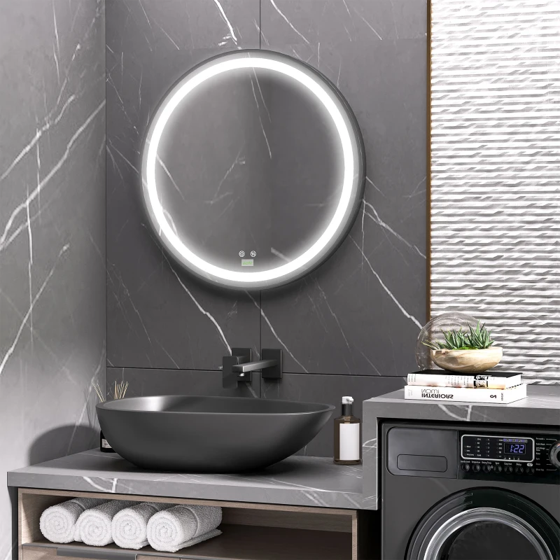 Circular LED mirror above gray vanity with black basin sink.
