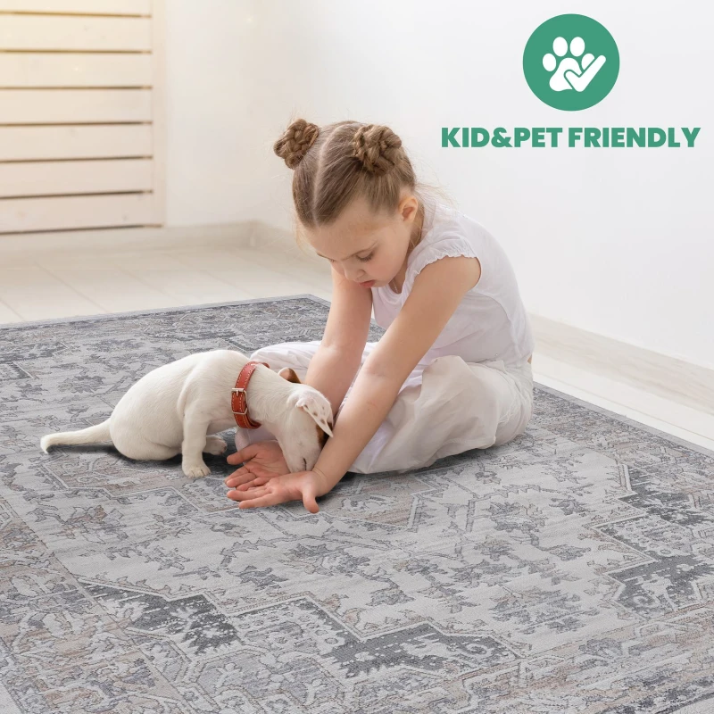 Child playing with puppy on gray patterned rug labeled kid- and pet-friendly.