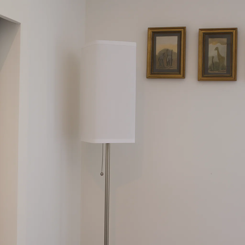 Tall floor lamp with white shade placed against living room wall