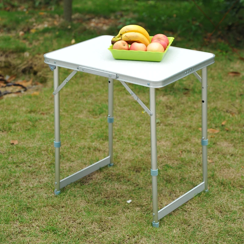 Portable aluminum camping table with fruit basket.