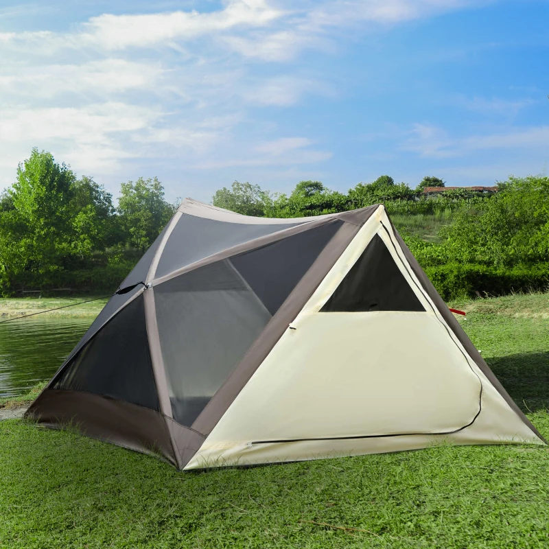 Pop-up camping tent with mesh panels beside lake