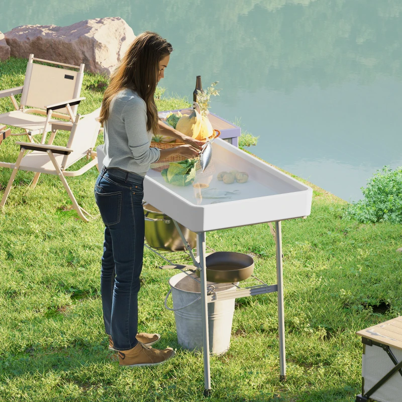 Portable ice cooler table for outdoor events with drainage.