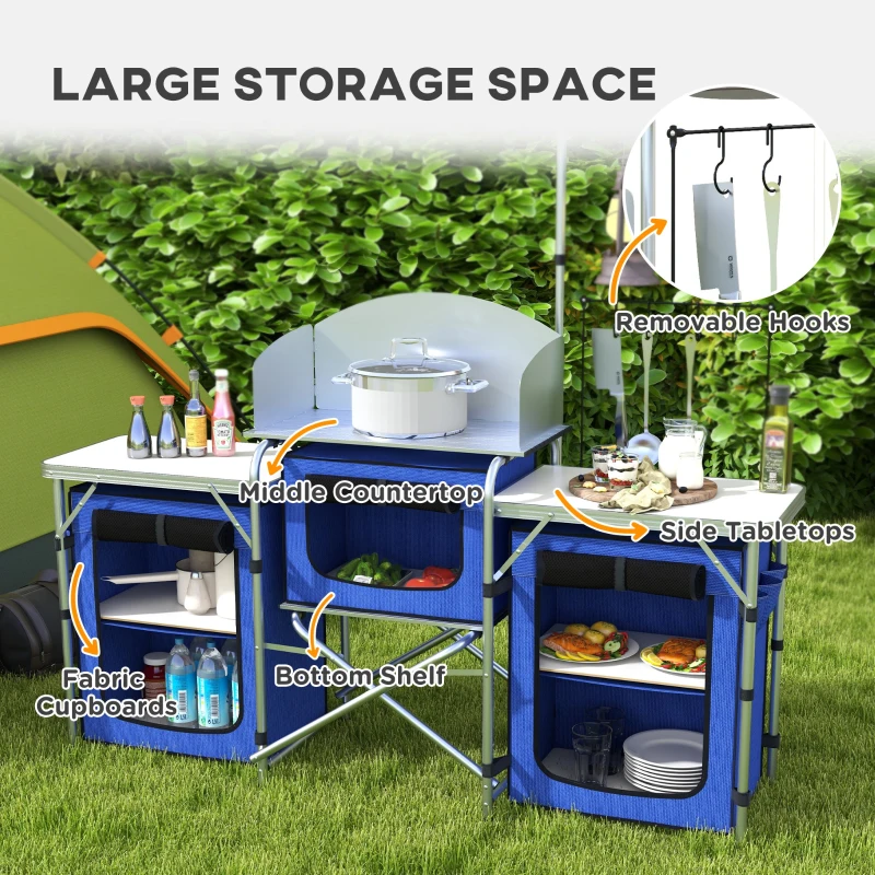 Portable kitchen with windscreen and storage for camping.