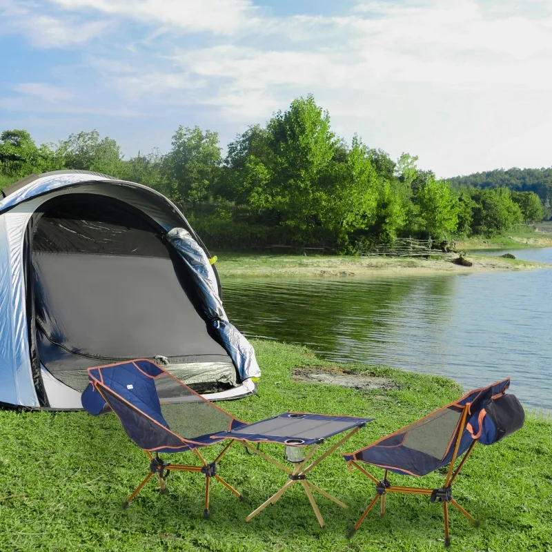 Quick setup of camping table and chairs for outdoor meals.
