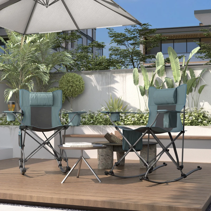 Two folding rocking chairs on wooden patio under outdoor umbrella