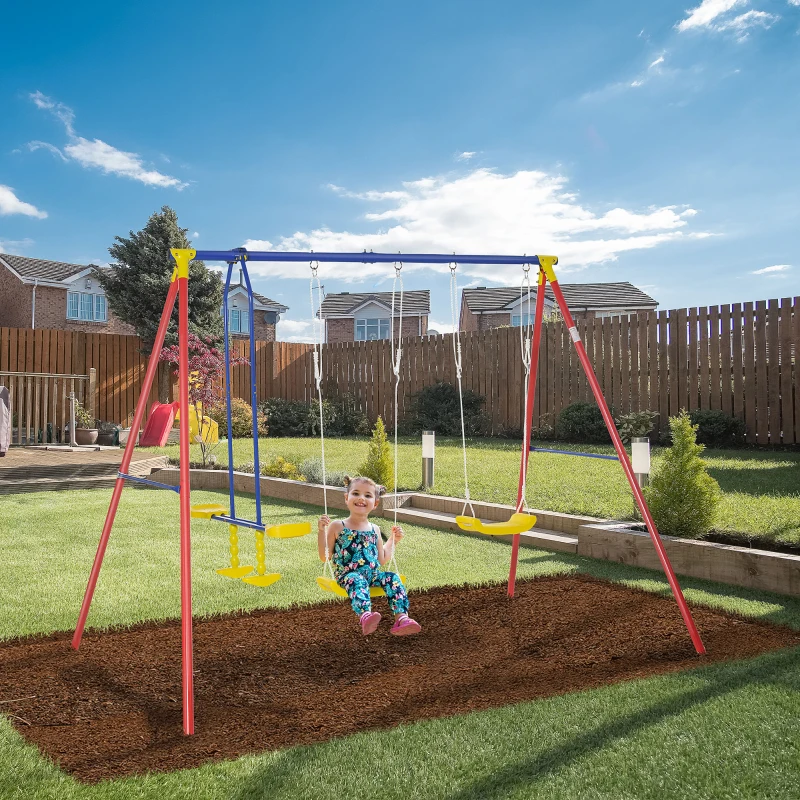 Toddler swinging on colorful metal swing set in backyard.