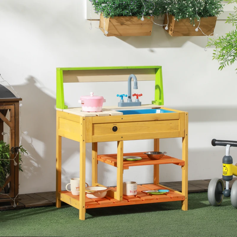 Wooden outdoor kids’ mud kitchen with colorful sink and shelves.