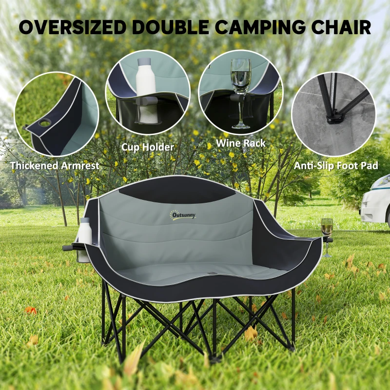 Oversized padded double camping chair with cup holders on grass