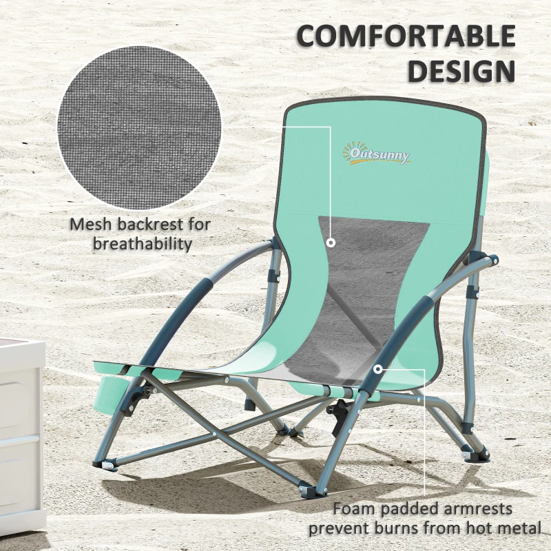 Lightweight turquoise beach chair with mesh backrest on sandy ground
