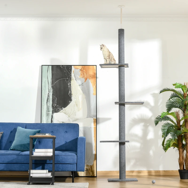 Tall ceiling-mounted cat tower with multiple climbing platforms.
