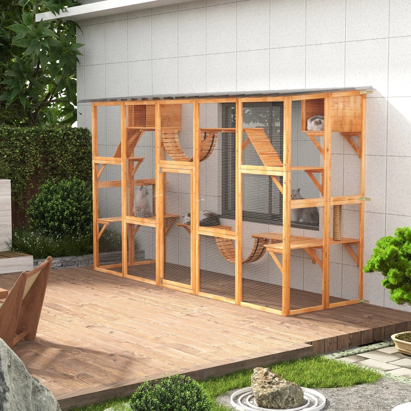 Large outdoor wooden catio with multiple levels for cats.