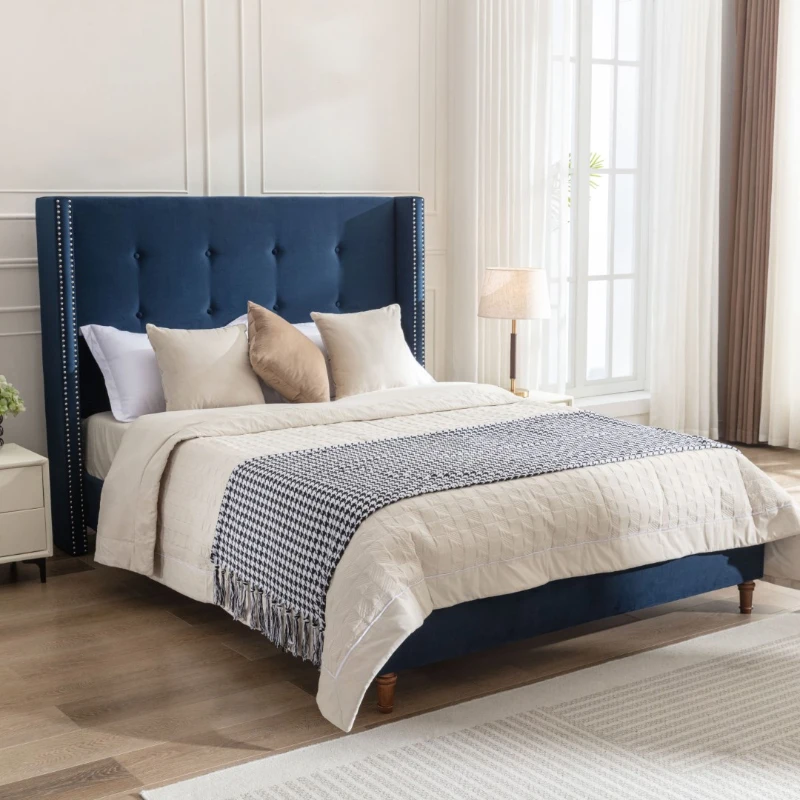 Luxurious king-size upholstered bed with tall headboard