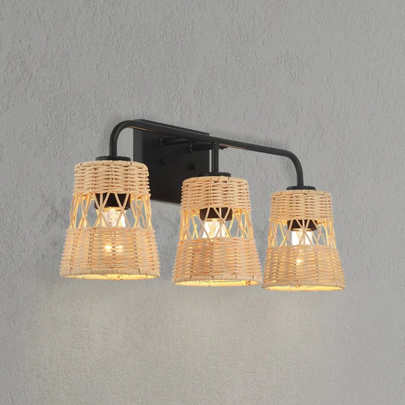 Three-light rattan wall fixture with black frame on gray wall