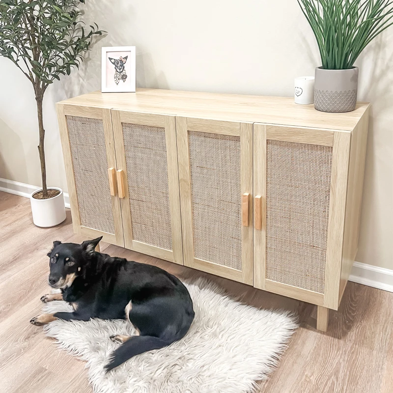 Light wood rattan-front sideboard with plant and dog on rug nearby.