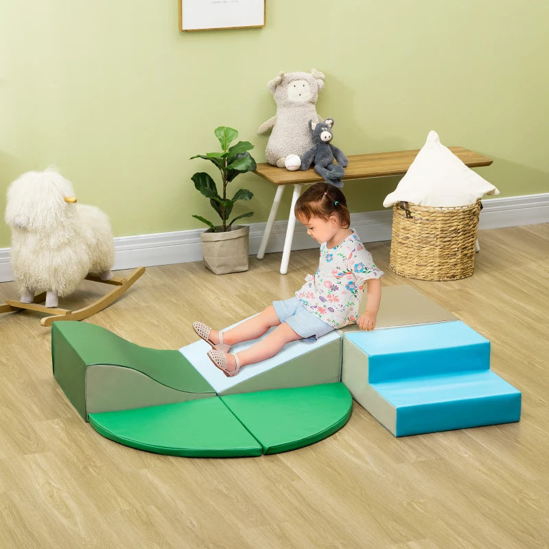 Toddler sliding down green and blue foam play set
