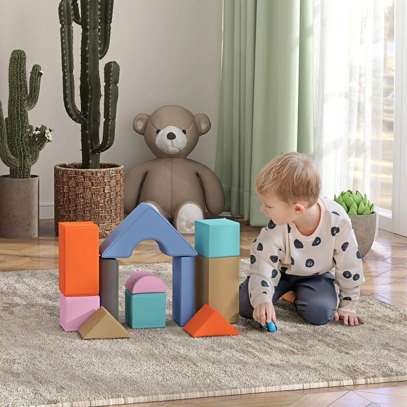 Boy building colorful foam block tower in cozy room