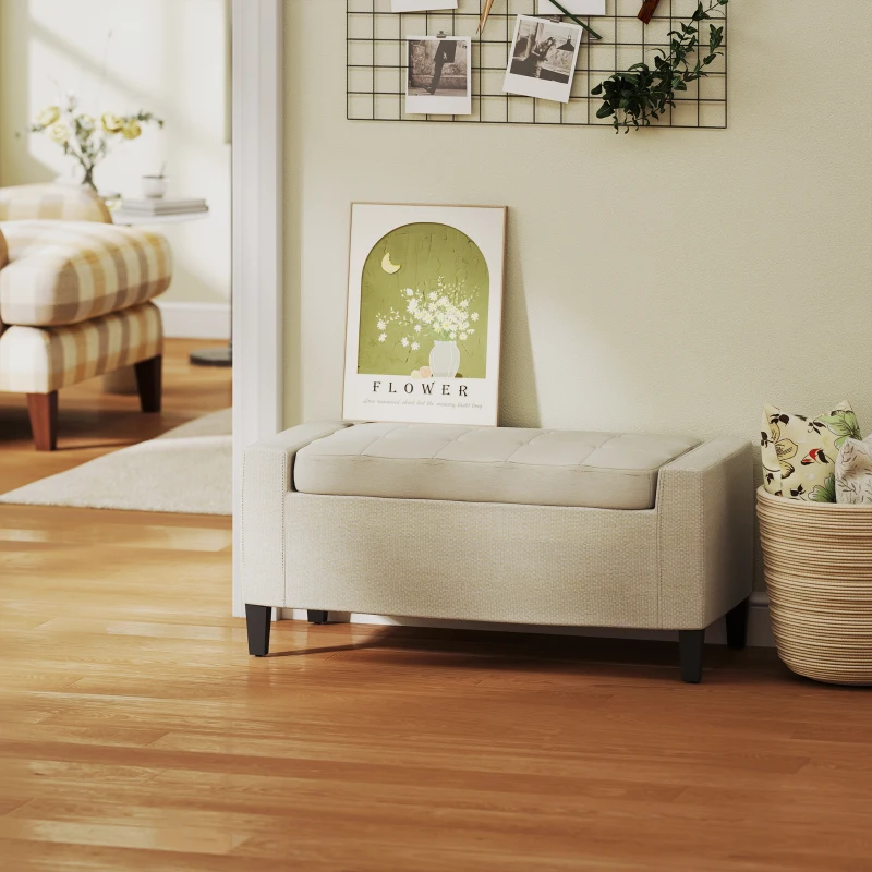 Beige storage ottoman in modern room styled with wall art and wood flooring