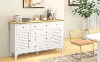 White sideboard with wooden top beside dining area and decor.