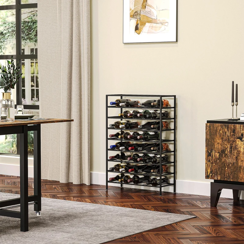 Black freestanding wine rack filled with bottles against beige wall.