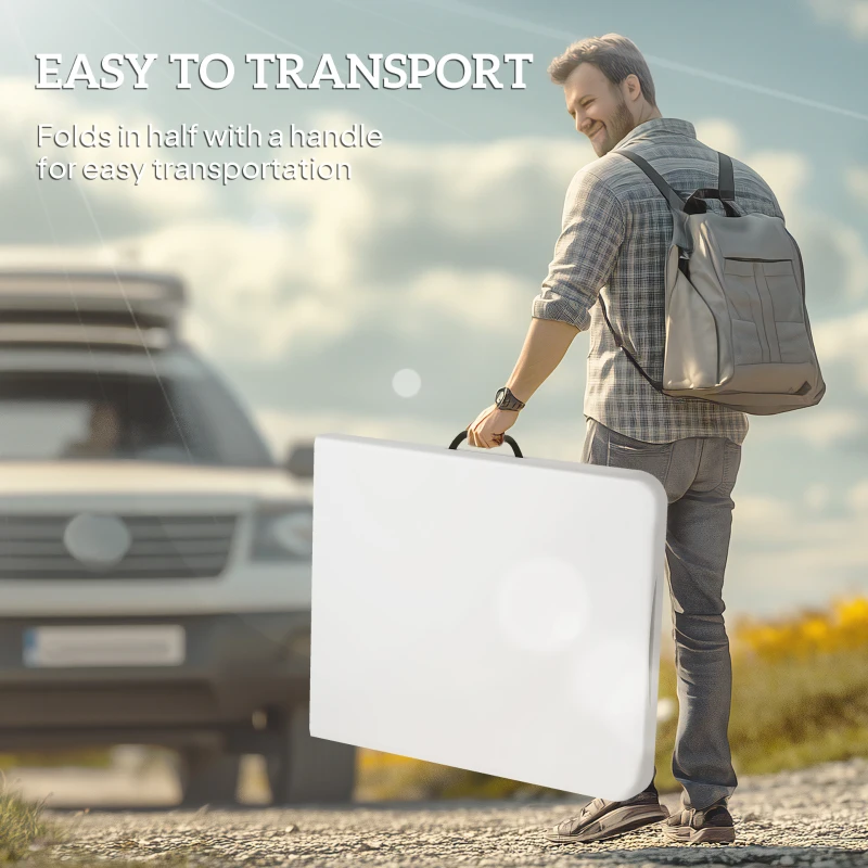 Man carrying a folded table for outdoor transport.