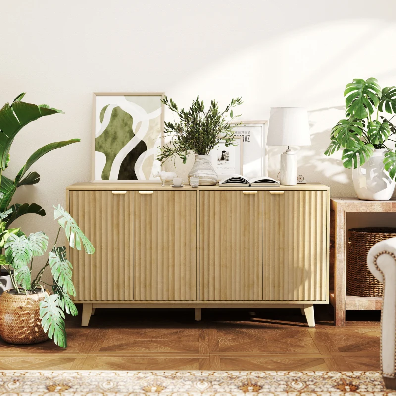 Wooden sideboard with décor accents and indoor plants in bright living room.