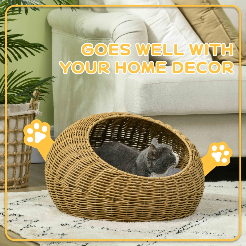 Cat lounging inside a low woven rattan dome bed styled to complement home décor.
