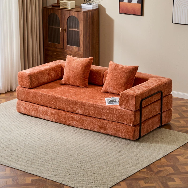 Orange velvet foldable floor sofa with cushions in cozy room.