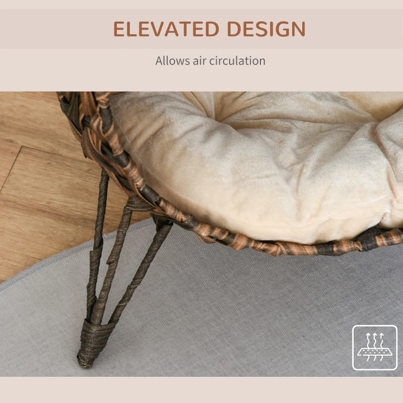 Close-up of an elevated rattan cat bed showing airflow under the cushion for ventilation.