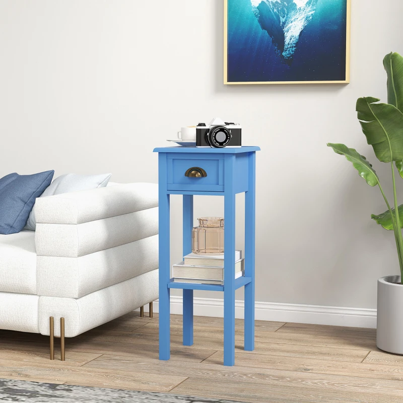 Blue narrow side table beside sofa with books and camera.