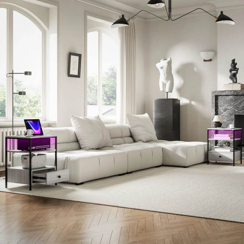 Modern living room with two matching purple glass side tables.