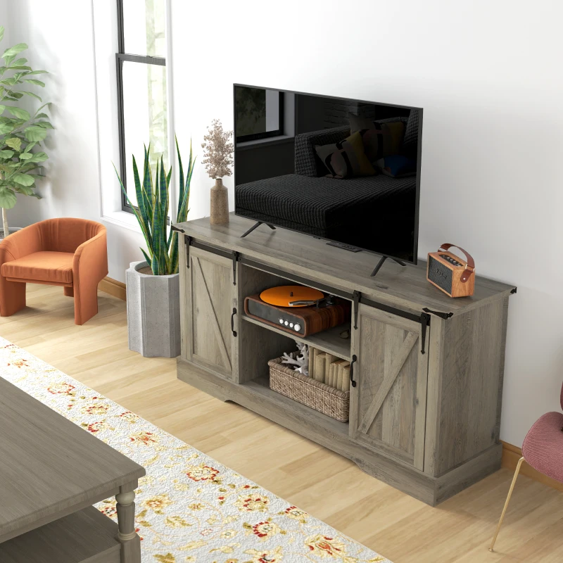 Gray sliding-door TV cabinet with décor and flat-screen television.