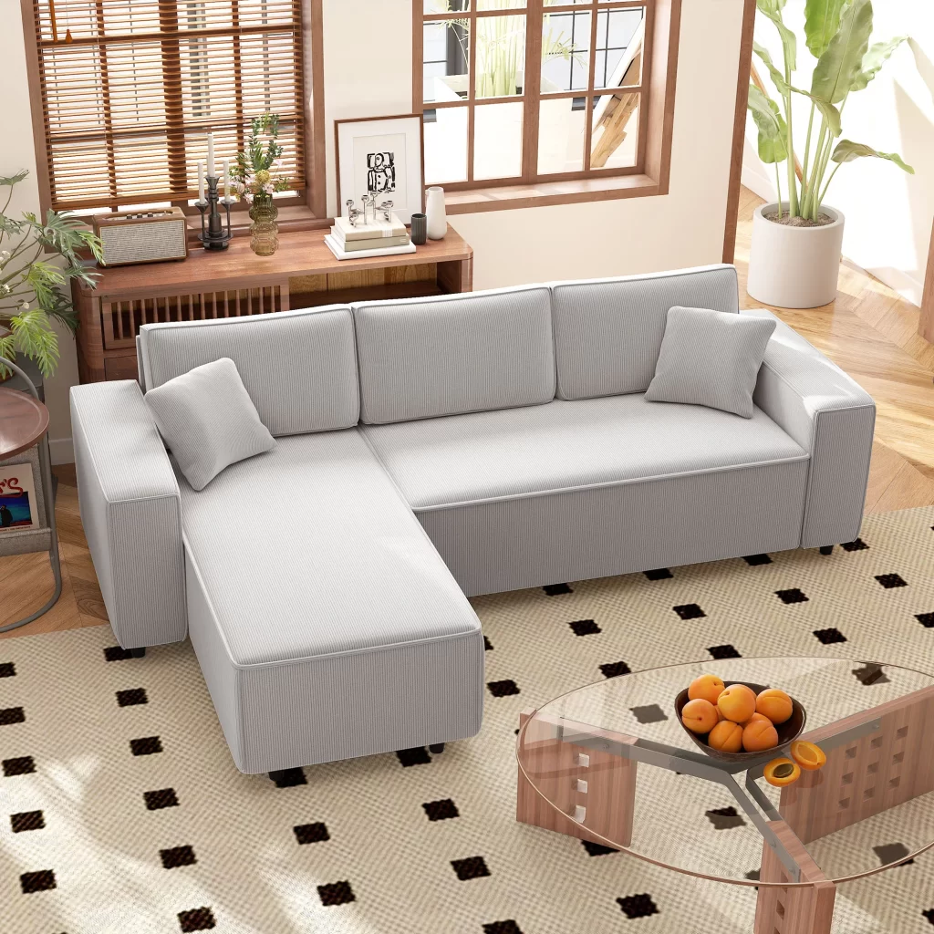 Light grey corner sofa with chaise lounge in bright living room.