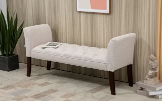 Minimalist hallway with white console table, framed art, and dark vase.